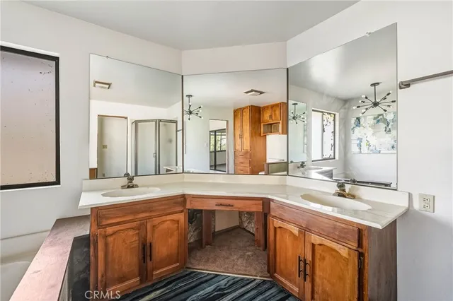 a kitchen with stainless steel appliances granite countertop a sink and a refrigerator