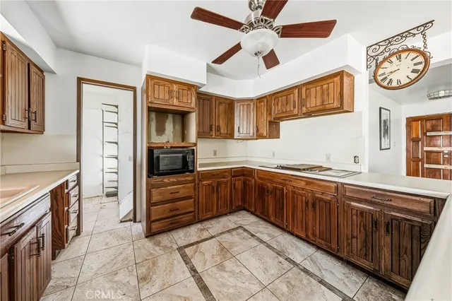 a view of a wooden balcony with a couple of chairs