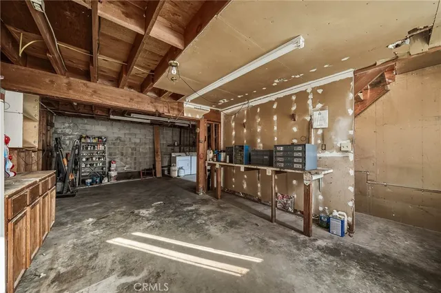 an aerial view of a house with a yard and lake view