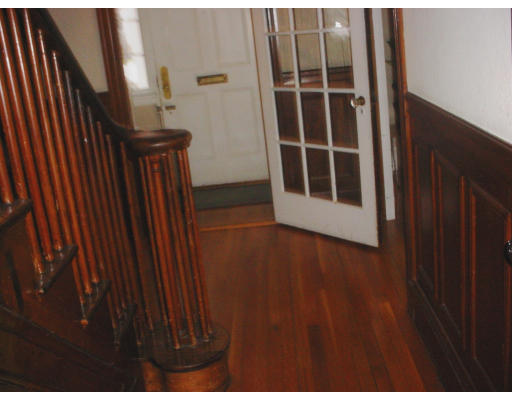 24 Stuart Road Newton, MA 02459 - Photo 4 of 11 a view of an empty room with wooden floor and a window