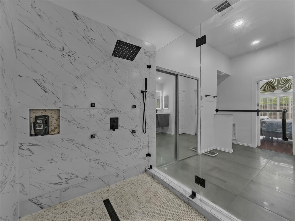 2317 Wellesly Road Rowlett, TX 75089 - Photo 21 of 39 a bathroom with a tub and shower