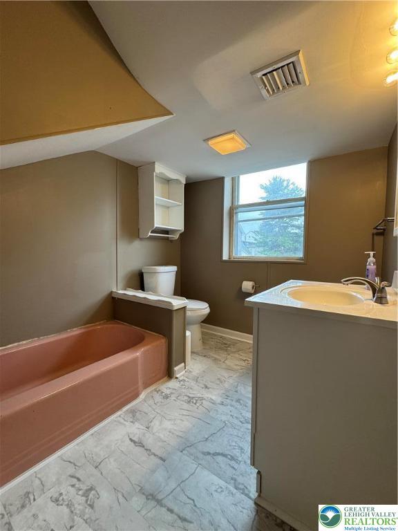 7 South Front Street, Unit A ( REAR) Coplay, PA 18037 - Photo 11 of 23 a bathroom with a sink a bathtub and a window