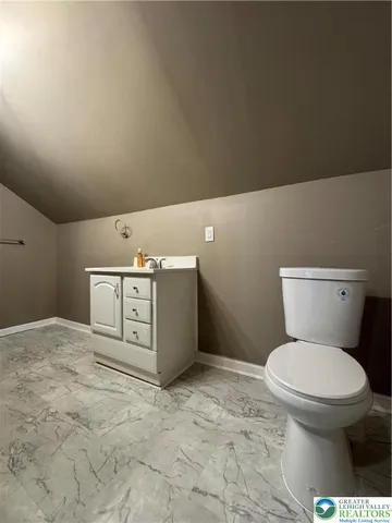 a bathroom with a toilet and a sink