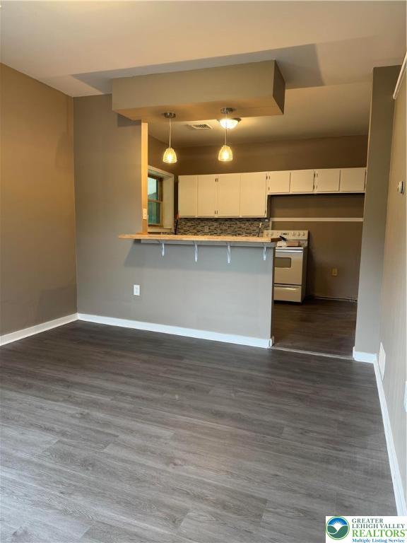 7 South Front Street, Unit A ( REAR) Coplay, PA 18037 - Photo 3 of 23 a view of a kitchen with a refrigerator and a window