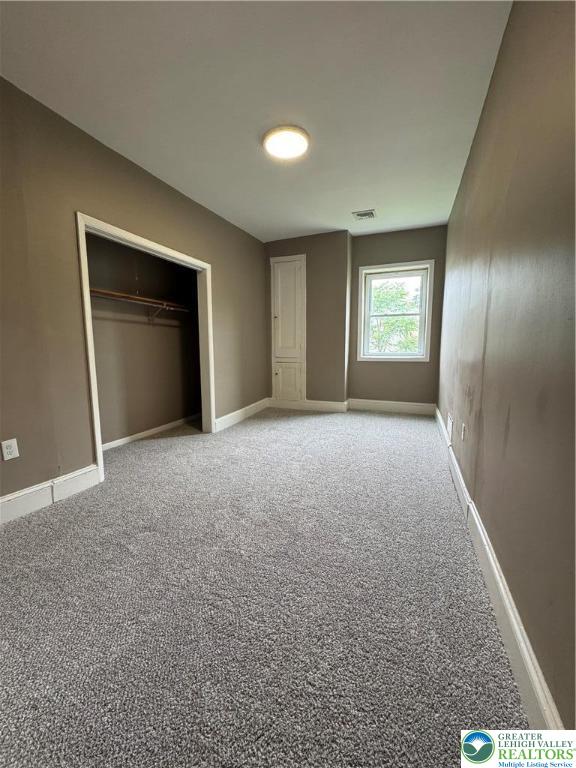 7 South Front Street, Unit A ( REAR) Coplay, PA 18037 - Photo 10 of 23 a view of empty room with window and wooden floor