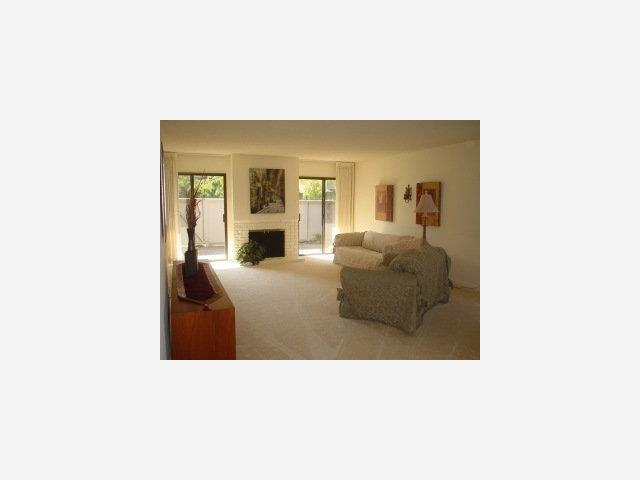 23 Bay Tree Lane Los Altos, CA 94022 - Photo 3 of 8 a living room with furniture and a flat screen tv