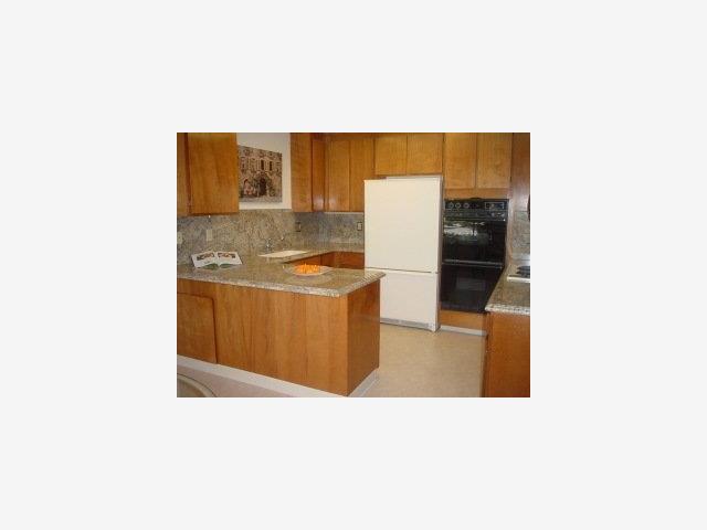 23 Bay Tree Lane Los Altos, CA 94022 - Photo 5 of 8 a kitchen with stainless steel appliances a refrigerator and a stove