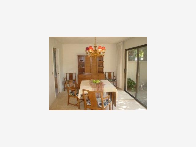 23 Bay Tree Lane Los Altos, CA 94022 - Photo 6 of 8 a picture of a living room with a table and chairs