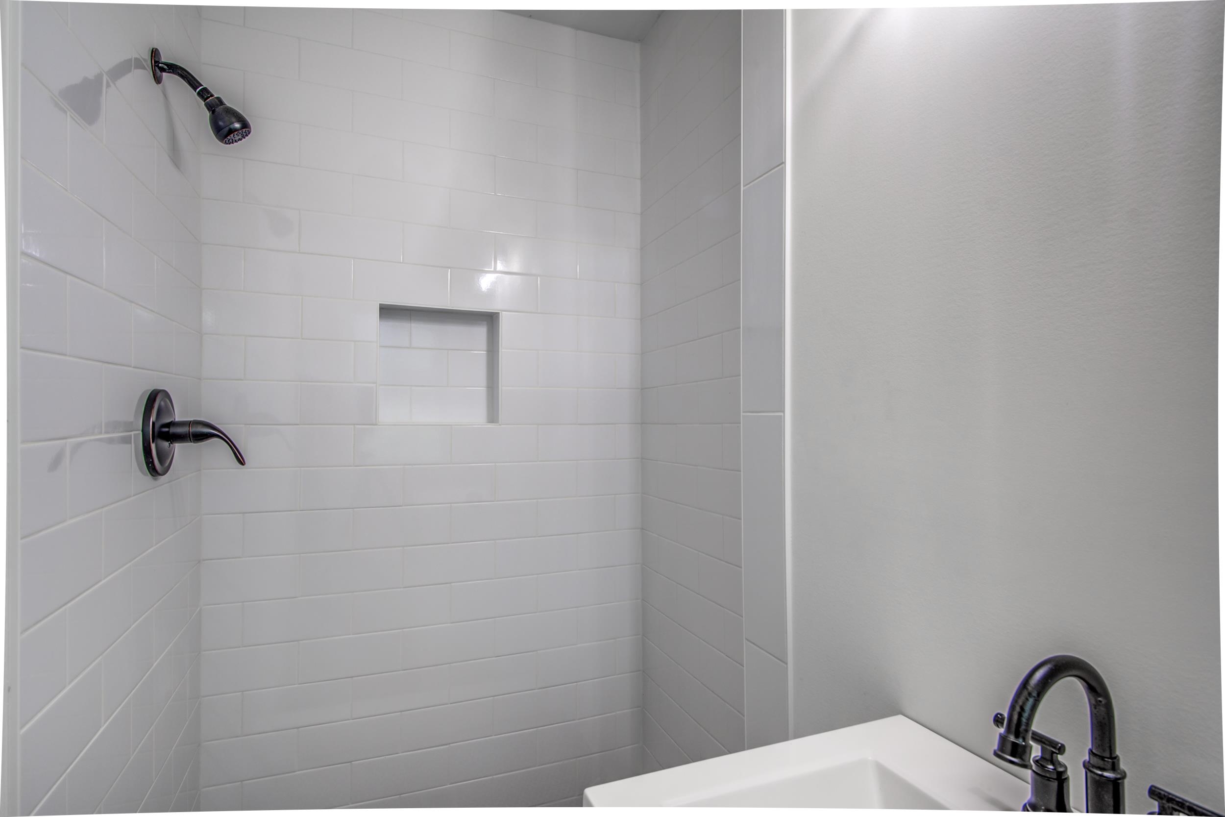 1110 Bluebird Road Memphis, TN 38116 - Photo 12 of 25 a bathroom with a shower