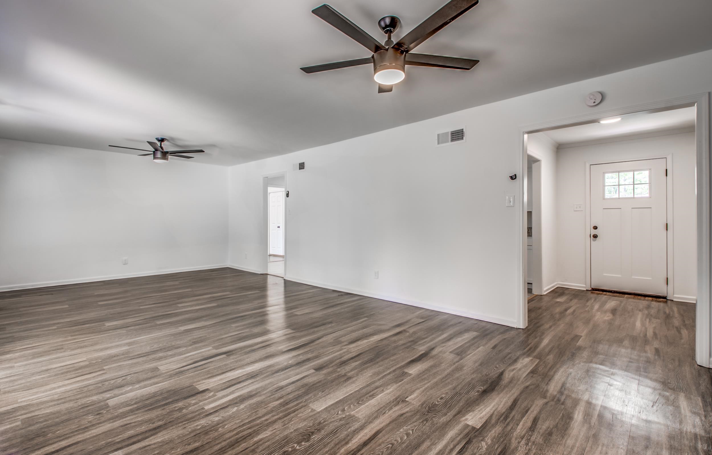 1110 Bluebird Road Memphis, TN 38116 - Photo 14 of 25 wooden floor in an empty room