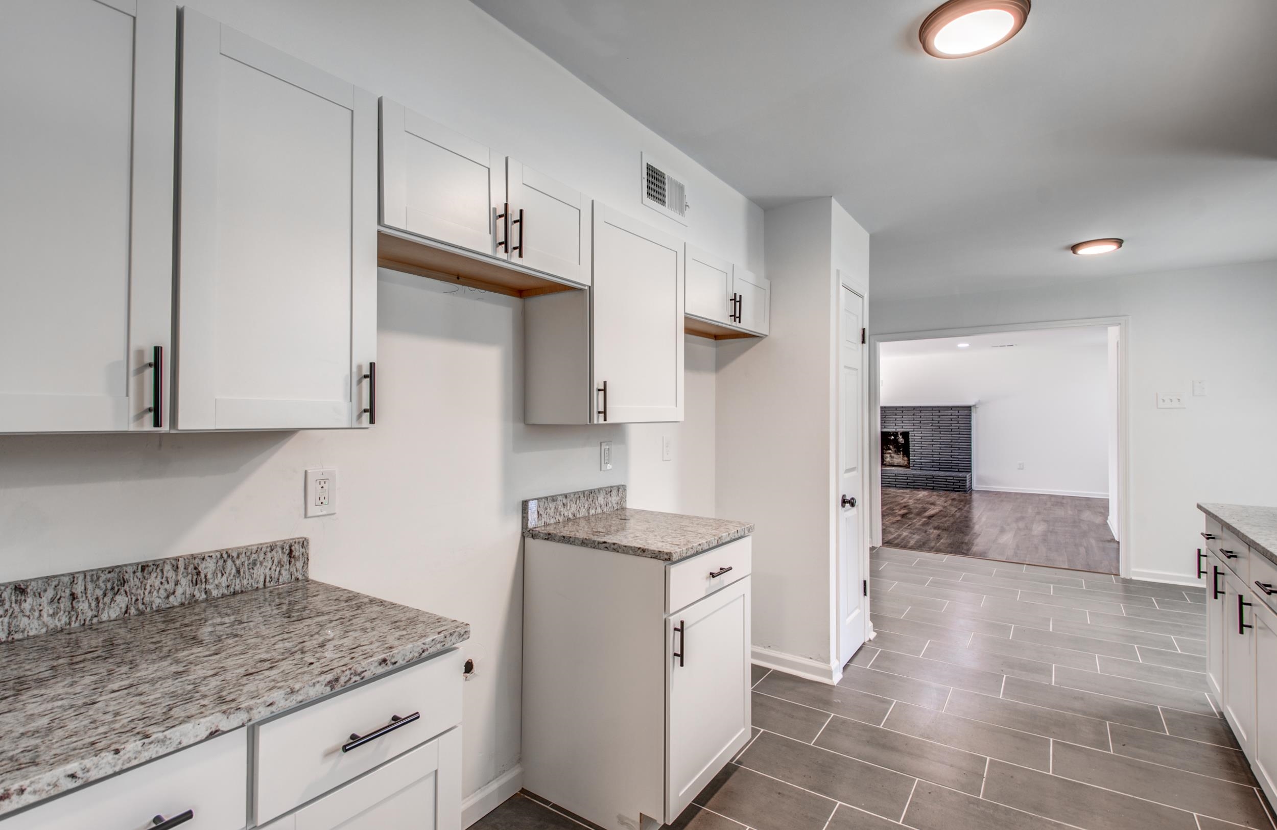 1110 Bluebird Road Memphis, TN 38116 - Photo 17 of 25 a kitchen with stainless steel appliances granite countertop a sink stove and cabinets