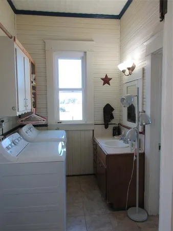 a bathroom with a sink vanity and mirror