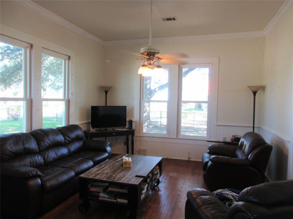 607 1st Street Rosebud, TX 76570 - Photo 19 of 29 a living room with furniture and a flat screen tv