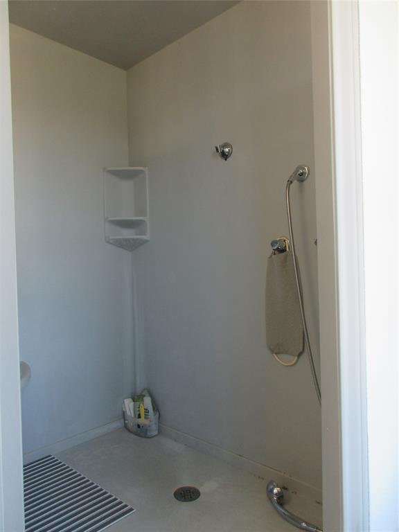 607 1st Street Rosebud, TX 76570 - Photo 26 of 29 a bathroom with a shower
