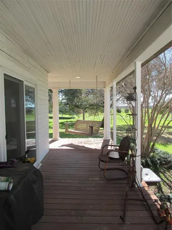 a room with balcony and wooden floor