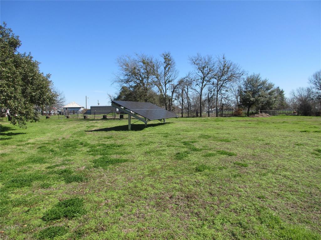 607 1st Street Rosebud, TX 76570 - Photo 6 of 29 a view of a grassy field with trees