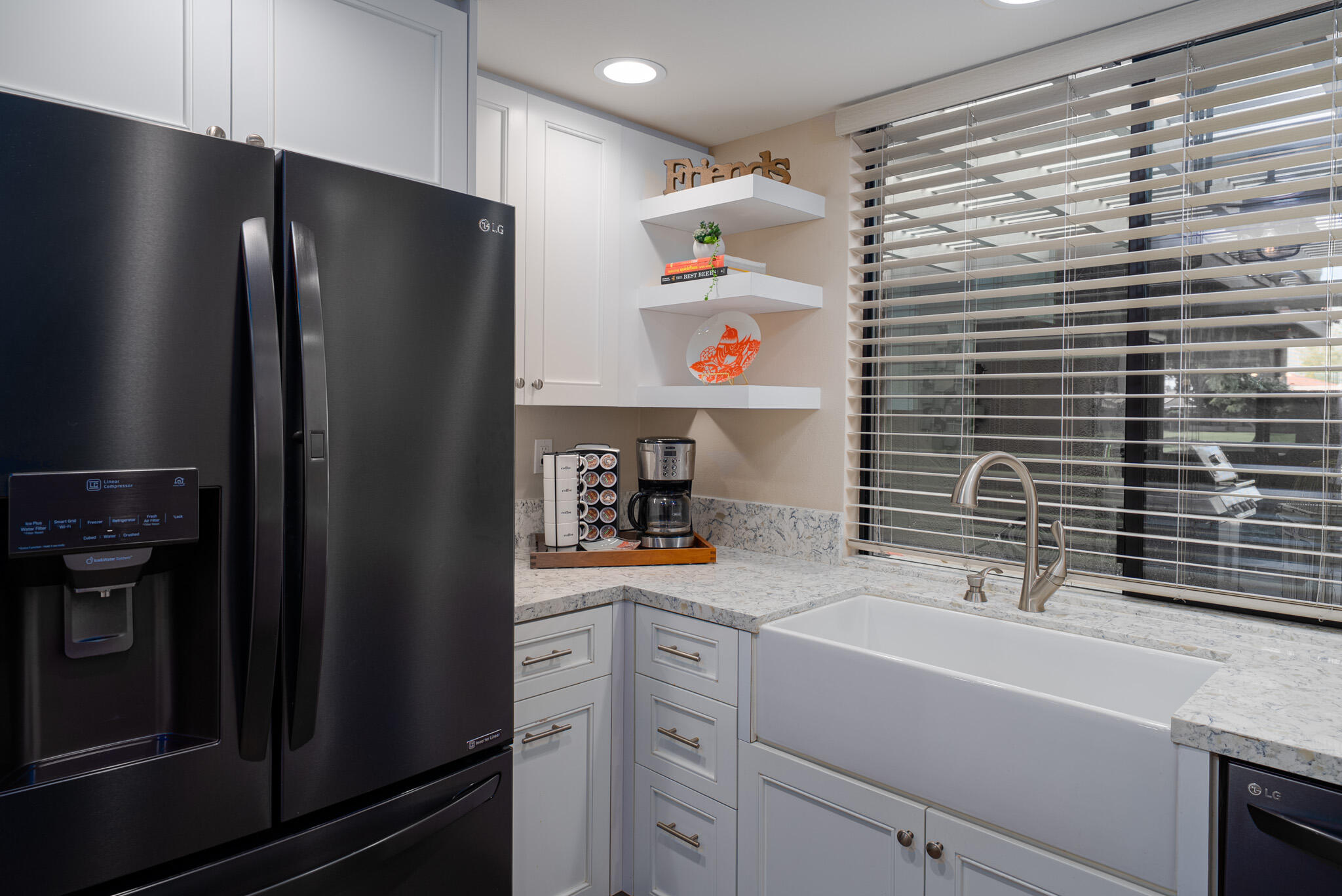 6 Sunrise Drive Rancho Mirage, CA 92270 - Photo 11 of 48 a kitchen with a refrigerator and a sink