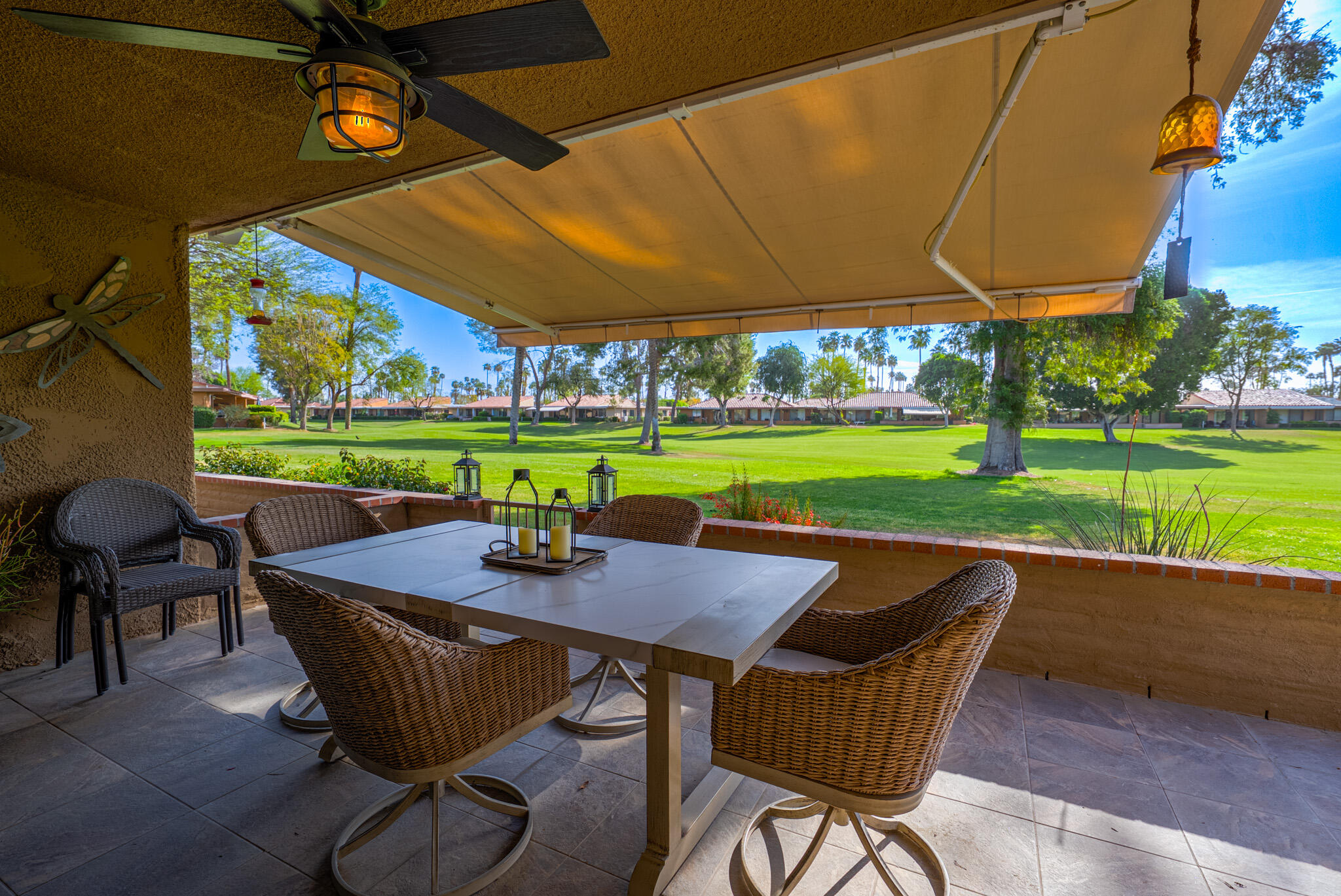 6 Sunrise Drive Rancho Mirage, CA 92270 - Photo 34 of 48 a view of a patio with a table chairs and a yard
