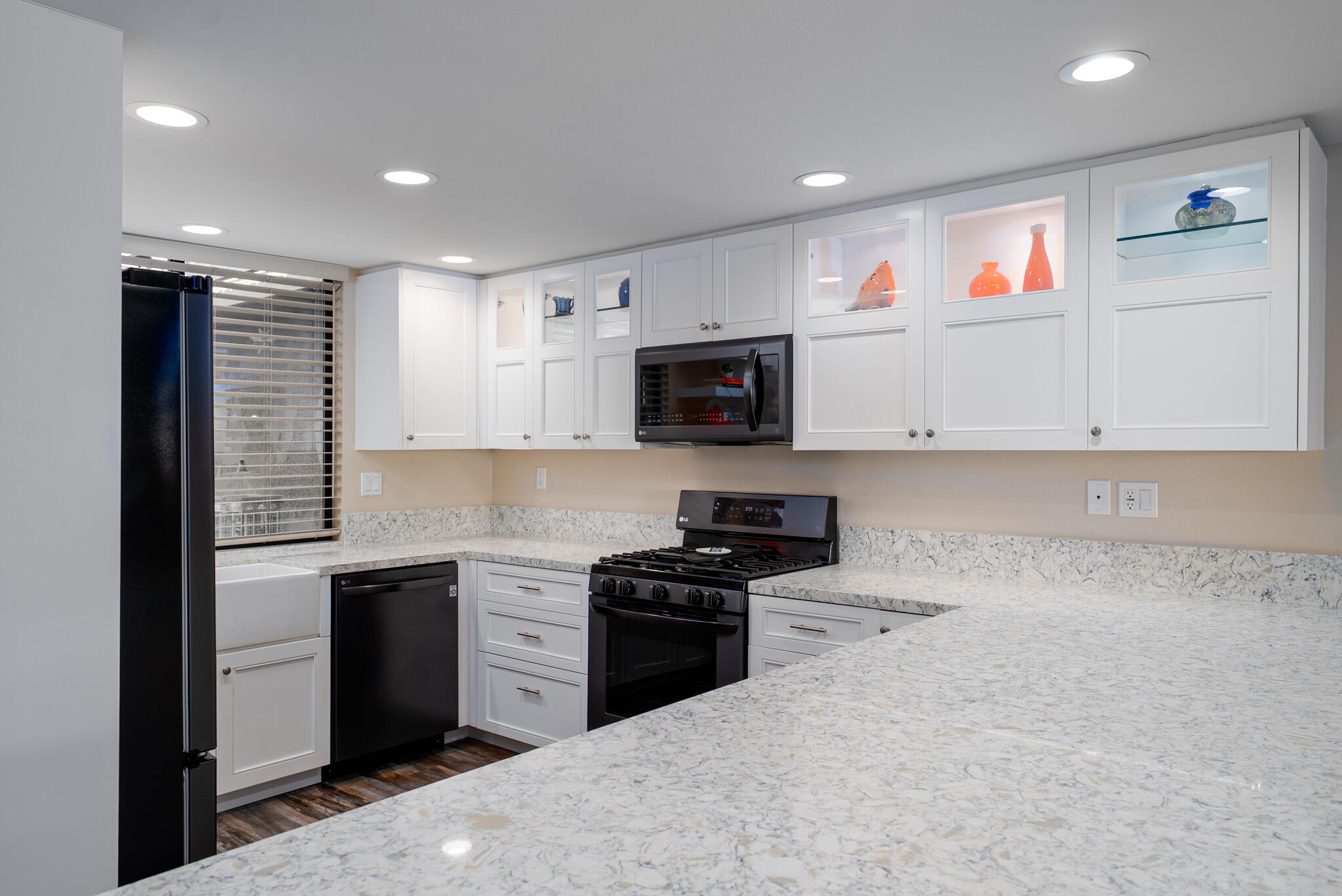 6 Sunrise Drive Rancho Mirage, CA 92270 - Photo 10 of 48 a kitchen with granite countertop white cabinets and stainless steel appliances