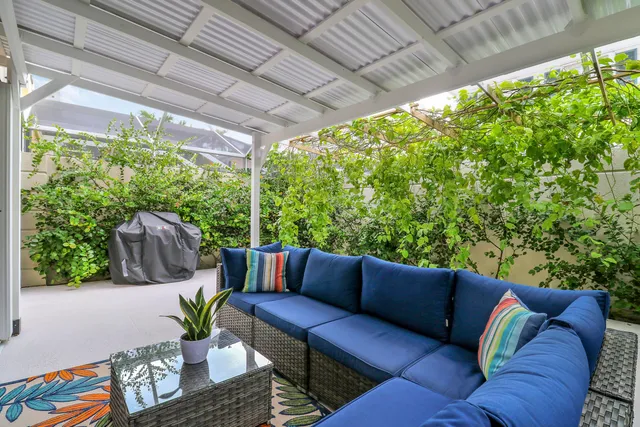 a outdoor living space with furniture and garden view