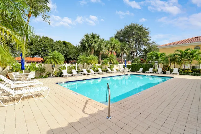 a view of a swimming pool with a lounge chairs