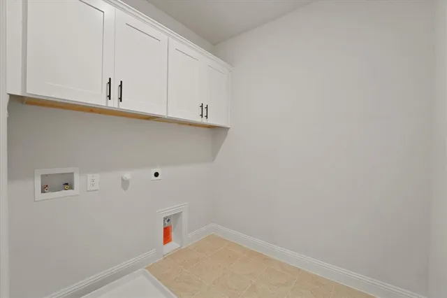 a view of storage and utility room with two washing machine
