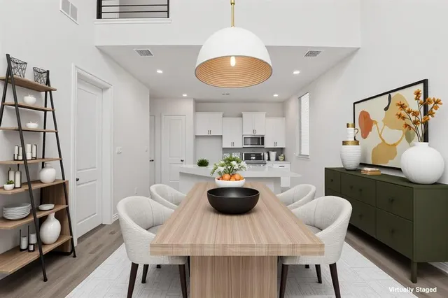 a kitchen with dining table and chairs
