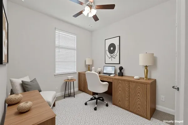 a workspace with furniture and window