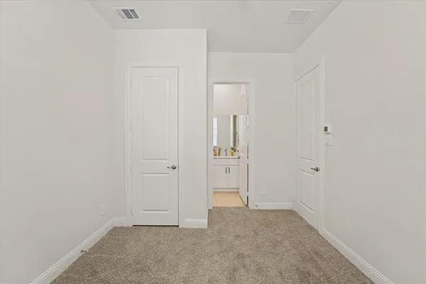an empty room with closet area
