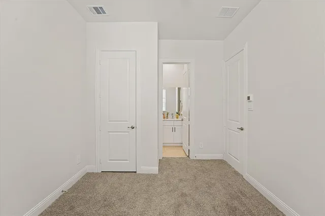 an empty room with closet area