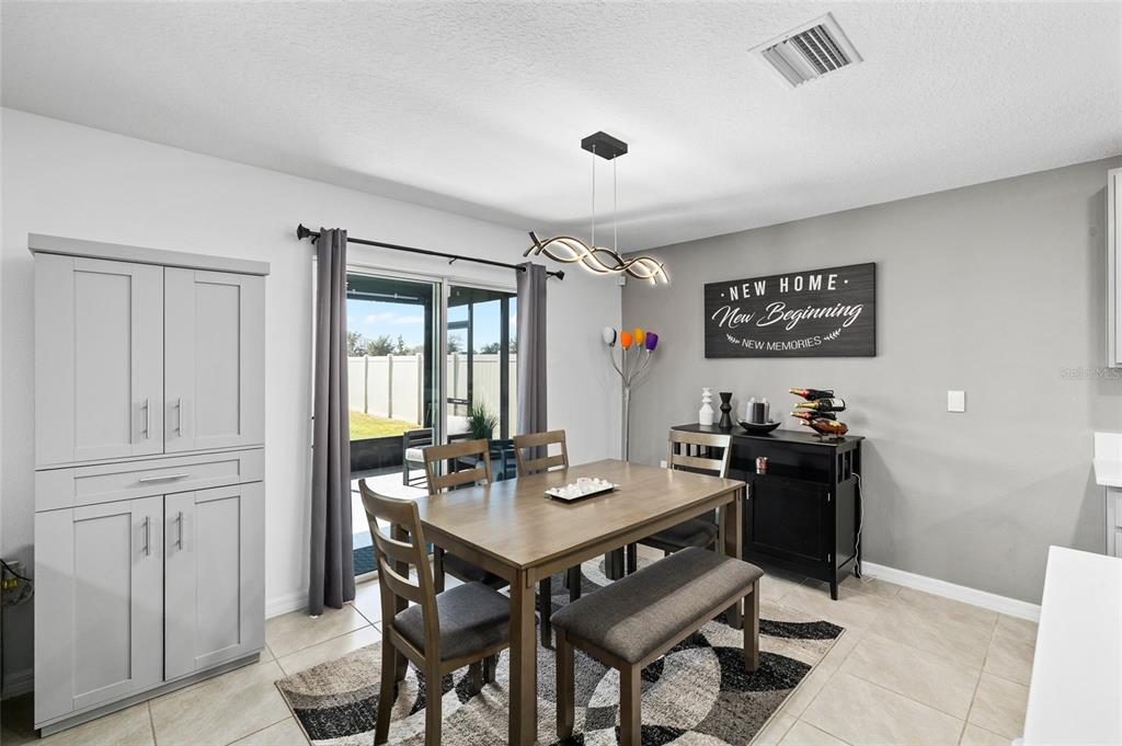 16507 Windmill Forge Pass Wimauma, FL 33598 - Photo 15 of 48 a view of a dining room with furniture