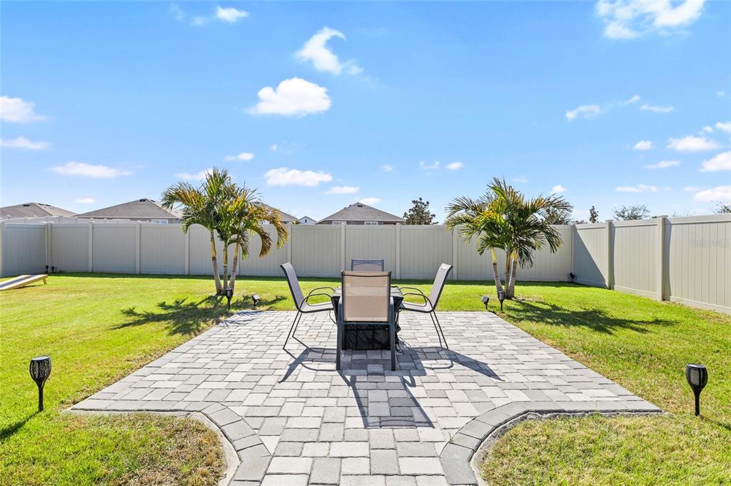 16507 Windmill Forge Pass Wimauma, FL 33598 - Photo 32 of 48 a view of an chairs and table in the patio