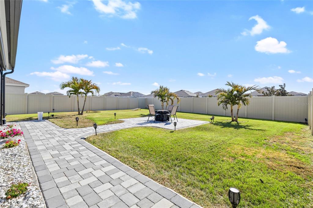 16507 Windmill Forge Pass Wimauma, FL 33598 - Photo 33 of 48 a swimming pool with yard