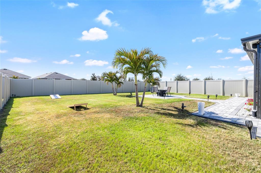 16507 Windmill Forge Pass Wimauma, FL 33598 - Photo 34 of 48 a swimming pool with yard and outdoor seating