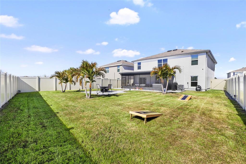 16507 Windmill Forge Pass Wimauma, FL 33598 - Photo 35 of 48 a swimming pool with outdoor seating and yard