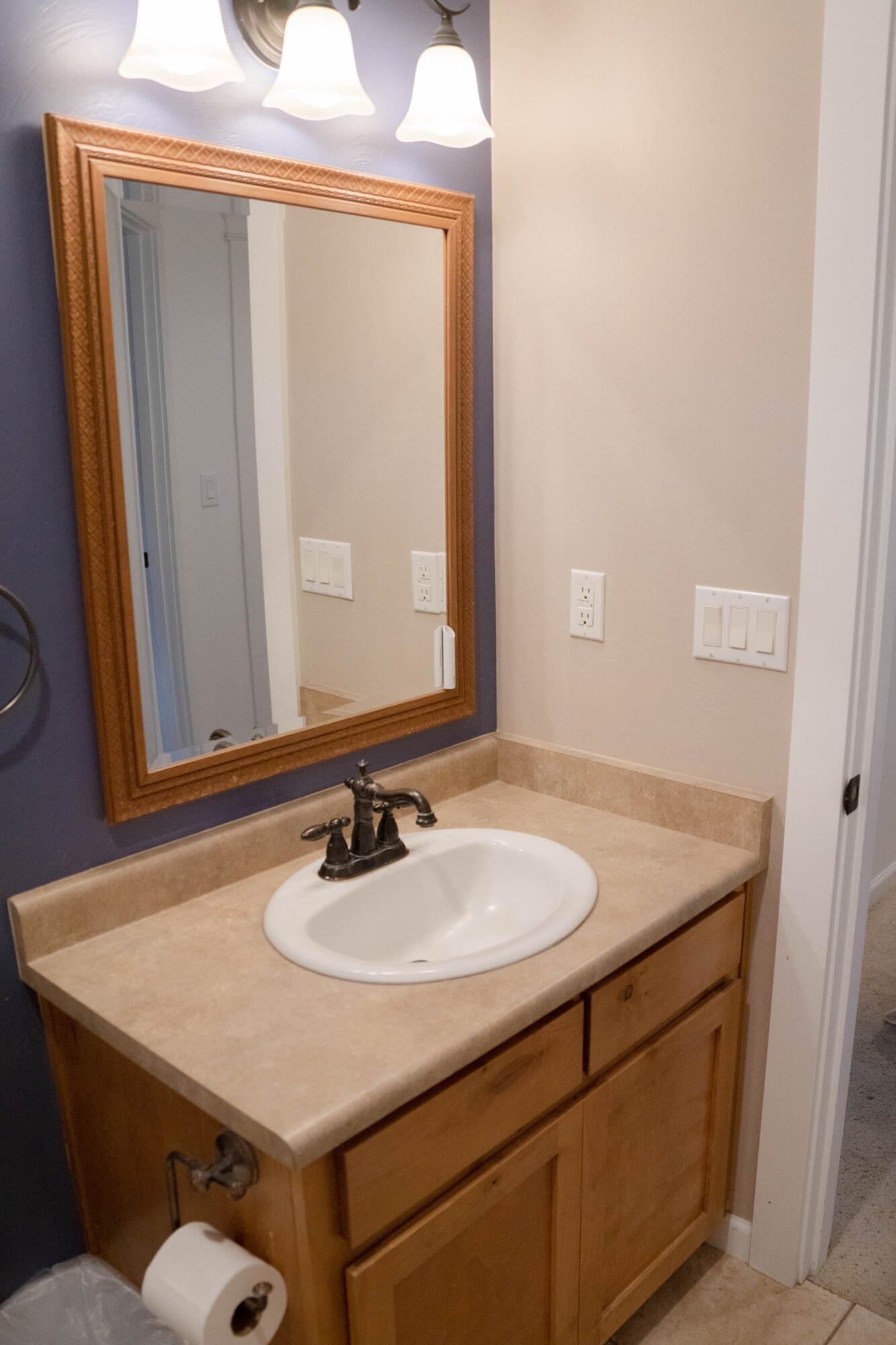 942 Win Way Eagle Point, OR 97524 - Photo 27 of 34 a bathroom with a sink vanity and a mirror