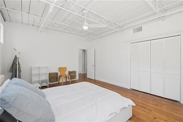 an empty room with wooden floor