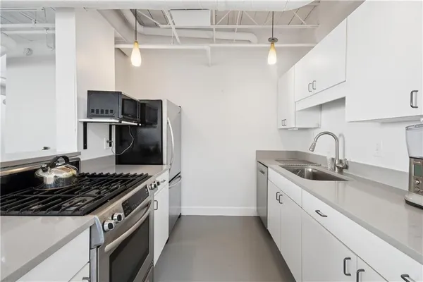 a view of a kitchen with washer and dryer