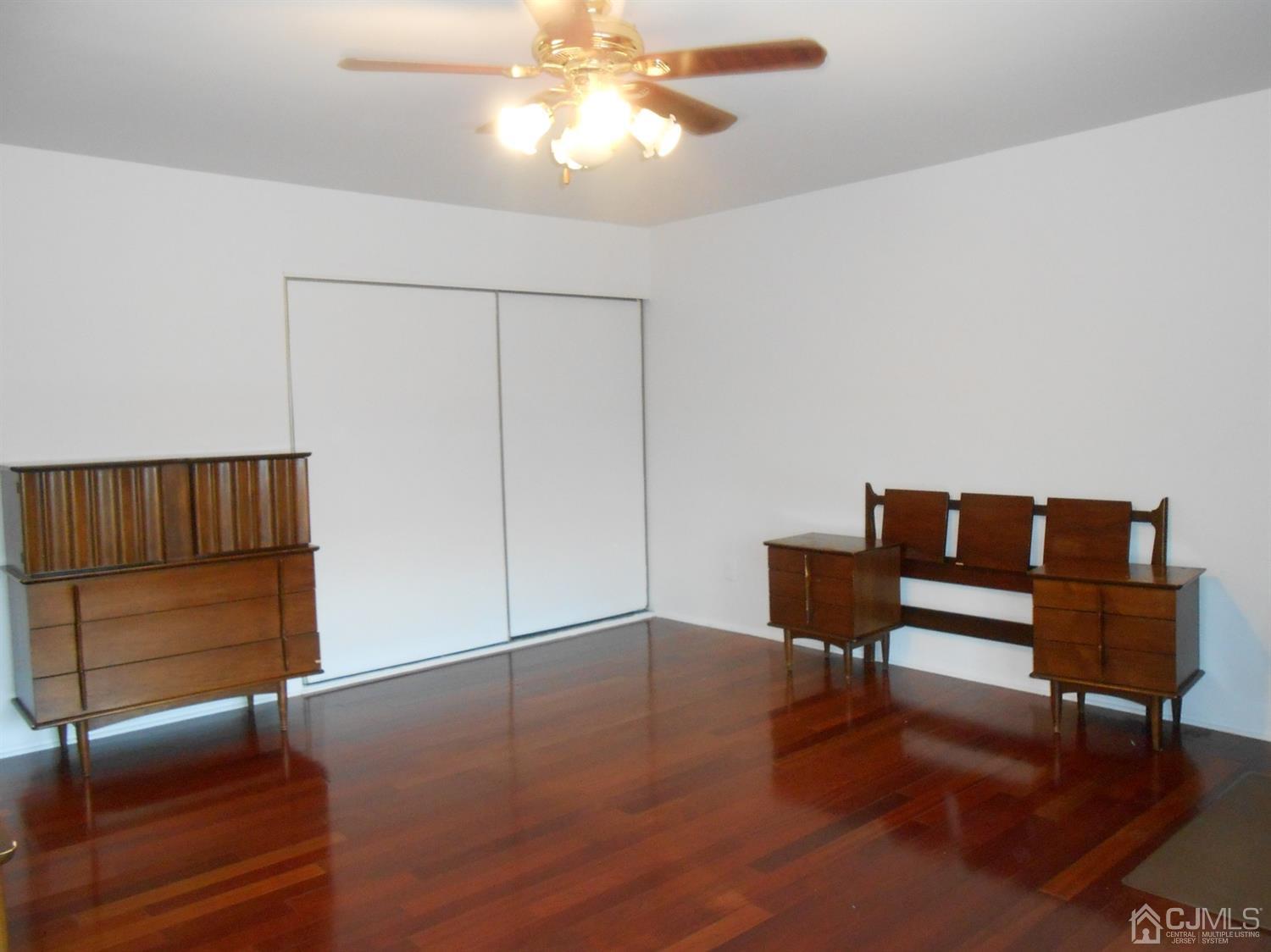 7206 Hana Road Edison, NJ 08817 - Photo 12 of 26 a view of a livingroom with furniture and wooden floor