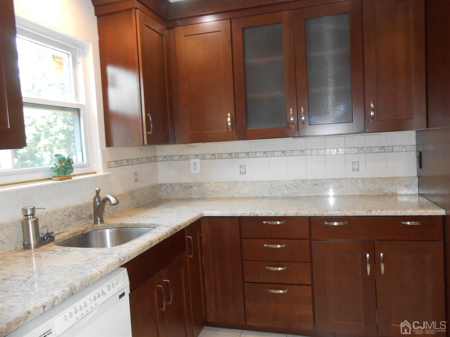 7206 Hana Road Edison, NJ 08817 - Photo 3 of 26 a kitchen with a sink and a window