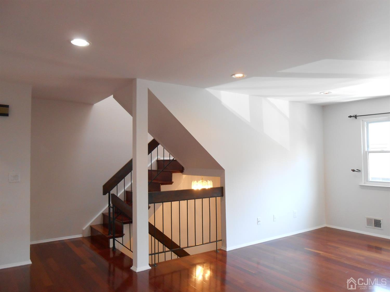 7206 Hana Road Edison, NJ 08817 - Photo 24 of 26 a view of entryway with wooden floor