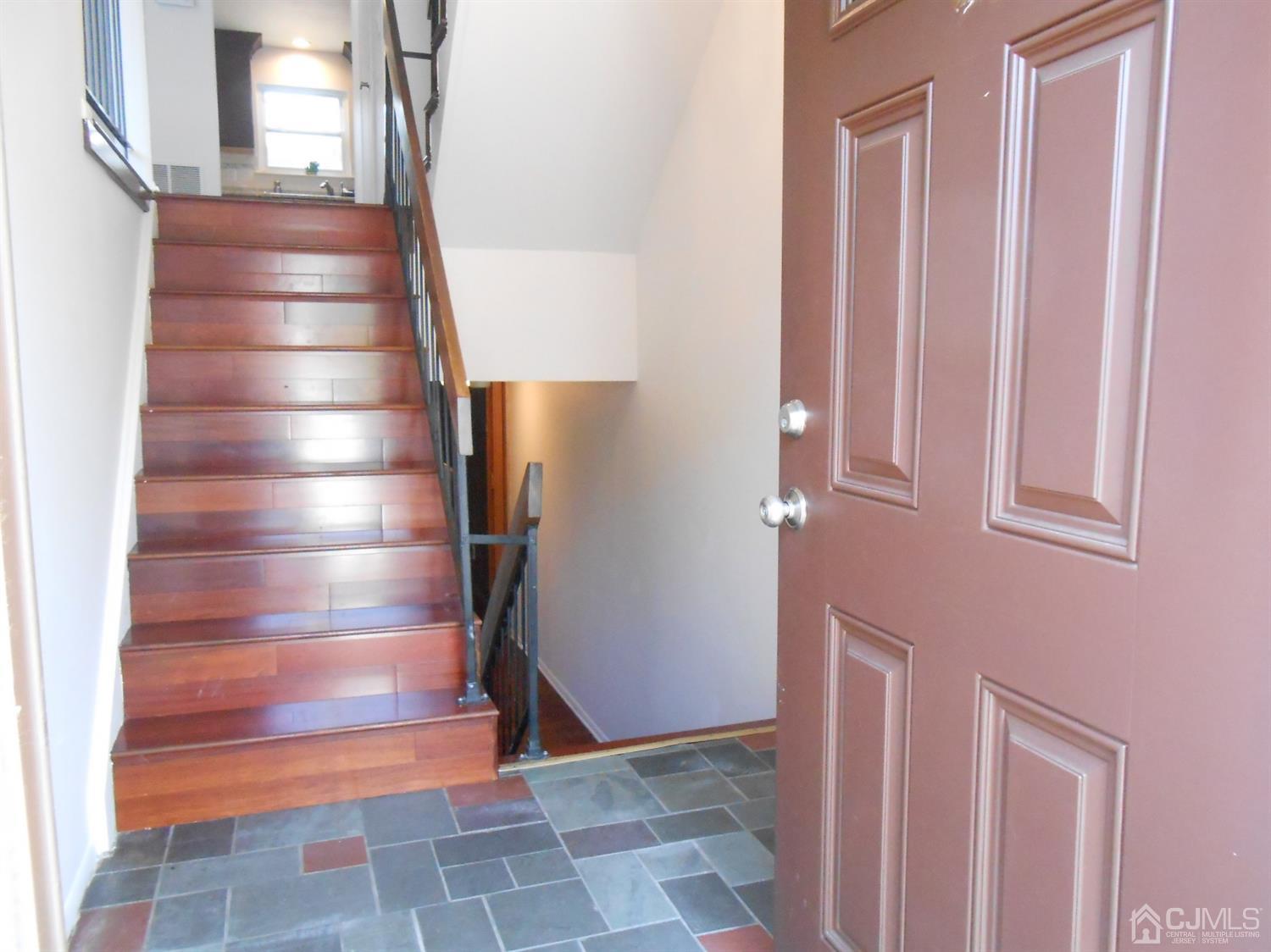 7206 Hana Road Edison, NJ 08817 - Photo 25 of 26 a view of entryway and hall with wooden floor