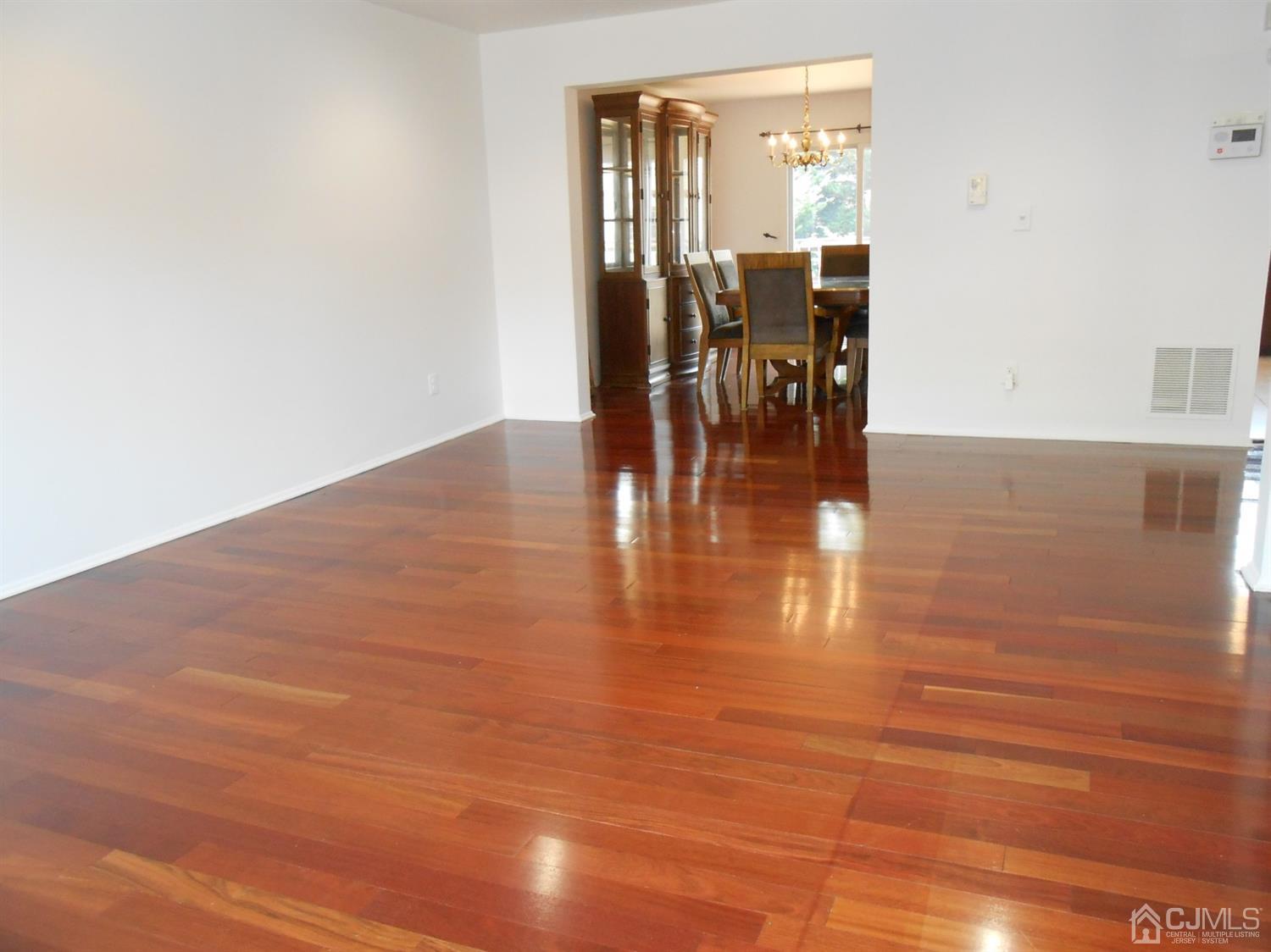 7206 Hana Road Edison, NJ 08817 - Photo 6 of 26 a view of a room with wooden floor