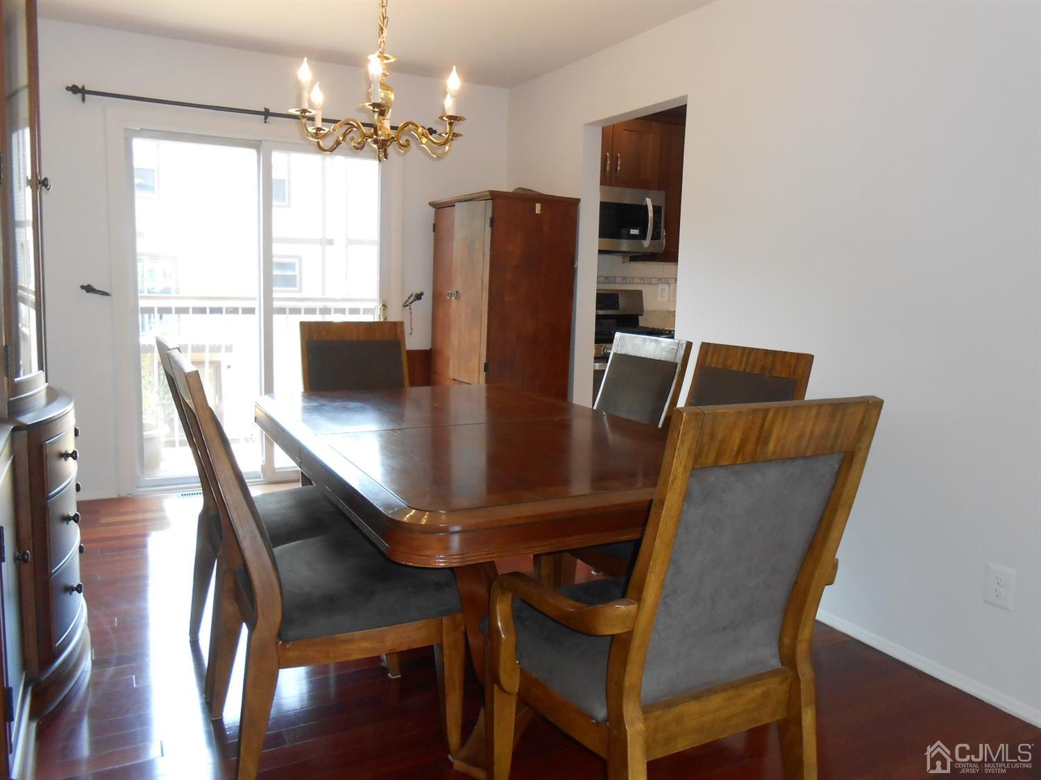 7206 Hana Road Edison, NJ 08817 - Photo 8 of 26 a view of a dining room with furniture window and wooden floor