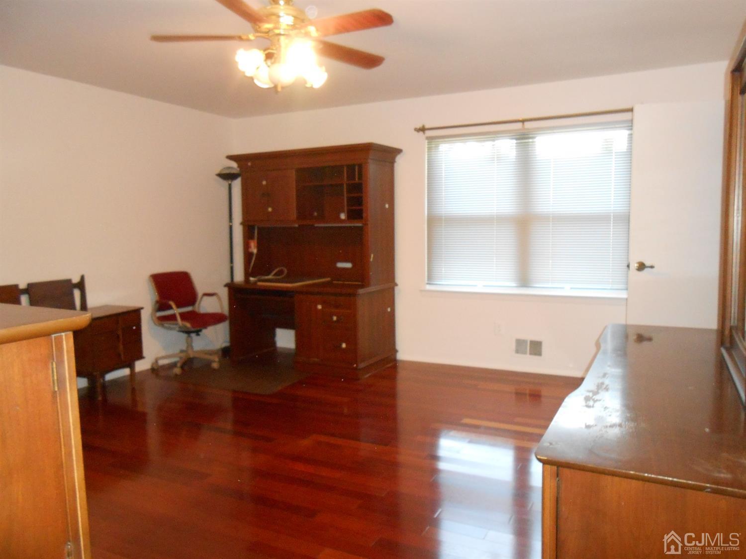 7206 Hana Road Edison, NJ 08817 - Photo 10 of 26 a living room with table chairs and a dining table
