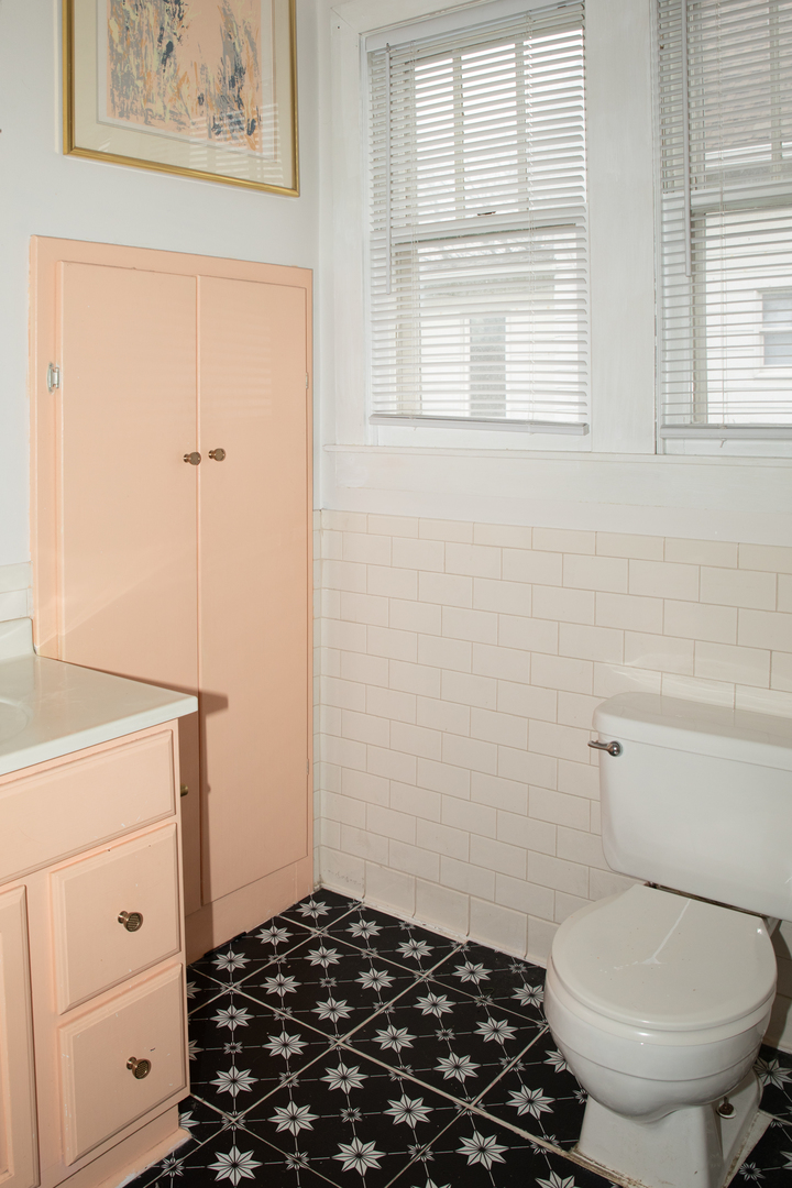 544 24th Avenue Moline, IL 61265 - Photo 14 of 24 a bathroom with a toilet and a window