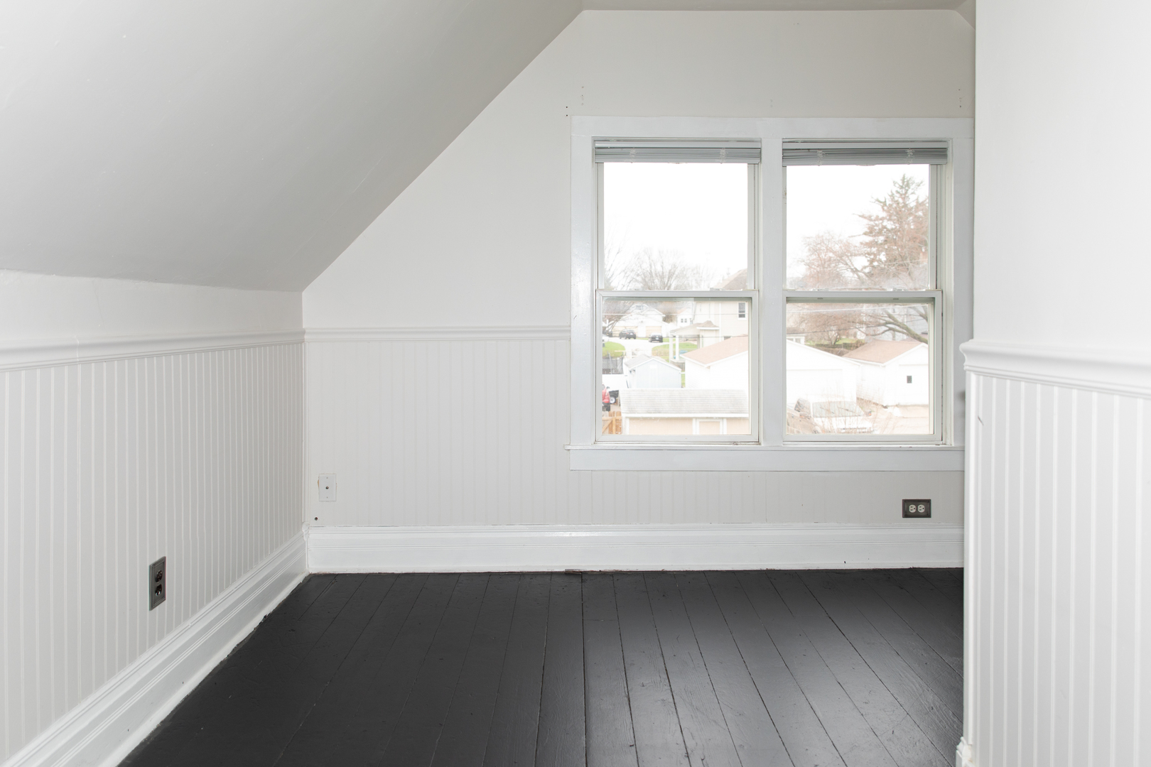 544 24th Avenue Moline, IL 61265 - Photo 18 of 24 a view of an empty room with wooden floor and a window