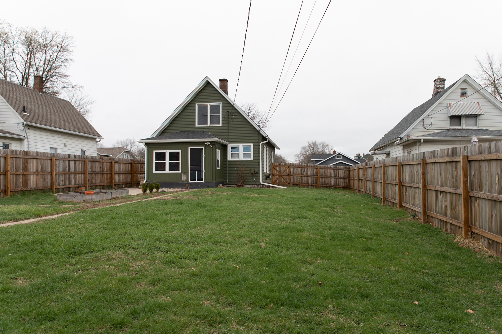 544 24th Avenue Moline, IL 61265 - Photo 22 of 24 a view of a house with a small yard and wooden fence