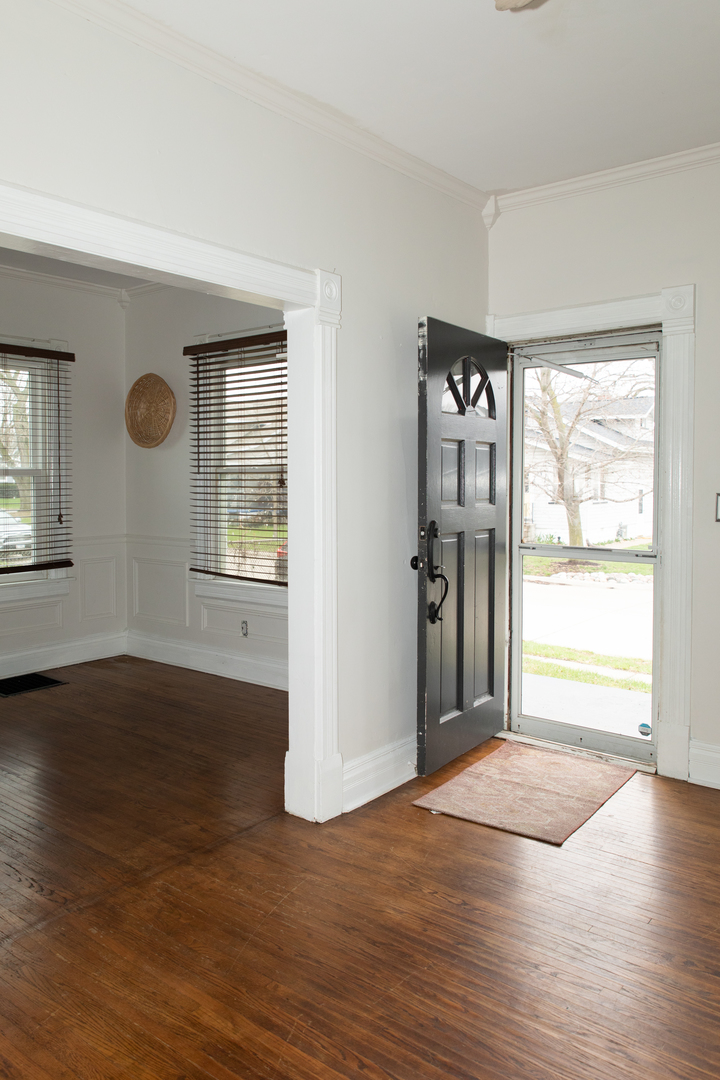 544 24th Avenue Moline, IL 61265 - Photo 8 of 24 an empty room with wooden floor and windows