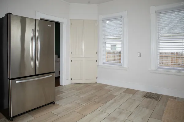 a view of kitchen with wooden floor and window